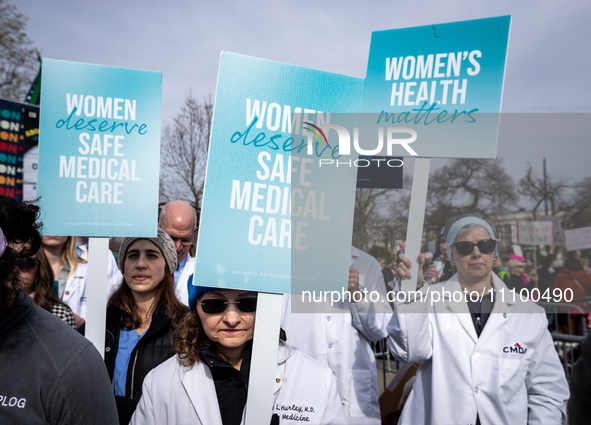 Doctors participate in an anti-abortion demonstration at the Supreme Court as it hears oral arguments in a case that could end access to med...