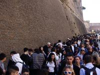 People stand in a line to the Vatican Museum in Rome, Italy on March 25, 2024. (