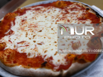 Pizza is seen at restaurant table in this illustration photo taken in Rome, Italy on March 25, 2024. (