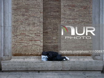 A person sleeps in Rome, Italy on March 25, 2024. (