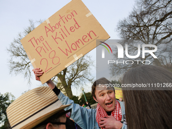 An anti-abortion rights demonstrator faces off with counterprotestors outside of the Supreme Court in Washington, D.C. on March 26, 2024 as...