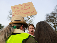 An anti-abortion rights demonstrator faces off with counterprotestors outside of the Supreme Court in Washington, D.C. on March 26, 2024 as...