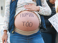 A pregnant anti-abortion rights demonstrator protests outside of the Supreme Court in Washington, D.C. on March 26, 2024 as the high court h...