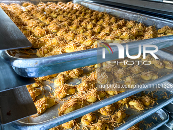 Workers are making cookies at the J&C Cookies factory in Bandung, Indonesia, on March 27, 2024. The cookie manufacturer, J&C Cookies, is pro...