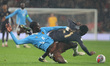 Amadou Onana of Belgium is tackling Kobbie Mainoo of Manchester United and England during...