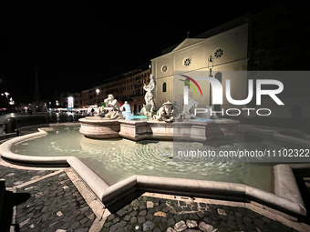 The fountain in Piazza Navona is illuminated at night in Rome, Italy, on March 24, 2024. (