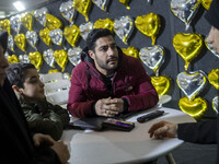 An Iranian man is speaking with a veiled counselor (R) to receive marriage counseling at the Imam Khomeini Grand Mosque during the 31st edit...