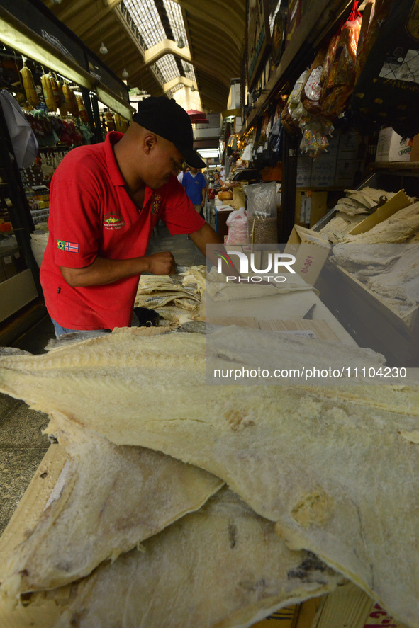 People are searching for fish at the Municipal Market on the eve of Good Friday in Sao Paulo, Brazil, on March 28, 2024. 
