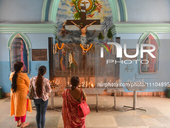 People are praying inside a church during the Good Friday observation in Kolkata, India, on March 29, 2024. (