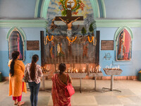 People are praying inside a church during the Good Friday observation in Kolkata, India, on March 29, 2024. (