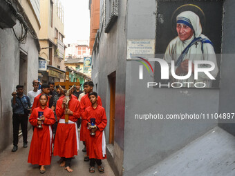 Children are carrying a cross during a rally organized to observe Good Friday in Kolkata, India, on March 29, 2024. (