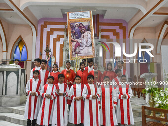 Children are seen praying inside a church during the Good Friday observation in Kolkata, India, on March 29, 2024. (