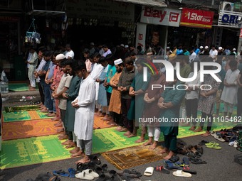 Muslims are performing salat (prayer) on the street at Elephant Road in Dhaka, Bangladesh, on March 29, 2024. (