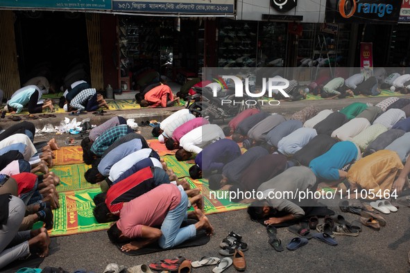 Muslims are performing salat (prayer) on the street at Elephant Road in Dhaka, Bangladesh, on March 29, 2024. 