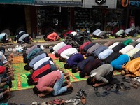 Muslims are performing salat (prayer) on the street at Elephant Road in Dhaka, Bangladesh, on March 29, 2024. (