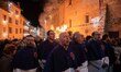 A group of men singing traditional choral singing are seen during Good Friday procession i...