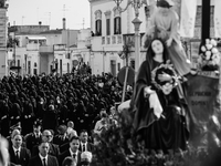 (EDITOR'S NOTE: Image was converted to black and white)  The statue of Our Lady Desolate is being displayed with the women's choir behind it...