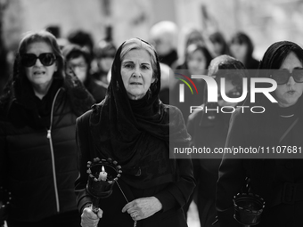 (EDITOR'S NOTE: Image was converted to black and white) Women are standing in front of the procession for the Madonna Desolata in Canosa di...