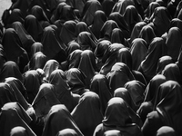 (EDITOR'S NOTE: Image was converted to black and white) Women are covering their faces during the procession for the Madonna Desolata in Can...