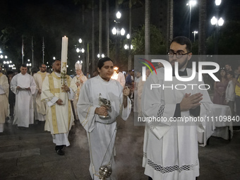 Cardinal Odilo Pedro Scherer is presiding over the Liturgy of the Light during the Easter Vigil Mass at the Cathedral of Se in Sao Paulo, Br...