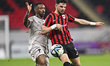 Bassam Husham Alrawi (R) of Al-Rayyan SC is battling for the ball with Ismail Mohamad of A...
