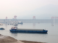 Cargo ships are sailing in the waters of the Xiling Gorge of the Three Gorges of the Yangtze River in Yichang, Hubei Province, China, on Apr...