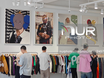 Customers are shopping at the first store of the US street brand Supreme in Shanghai, China, on April 1, 2024. (