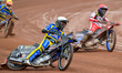 Tai Woffinden of the Sheffield Tigers (in white) is overtaking Belle Vue ATPI Aces' Brady...