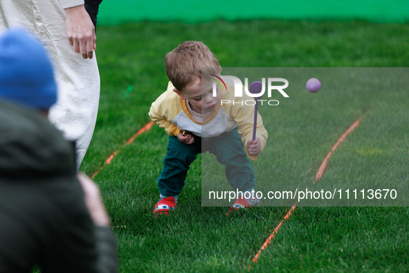 A child participates in the 2024 White House Easter Egg Roll on the South Lawn of the White House in Washington, D.C. on April 1, 2024. 