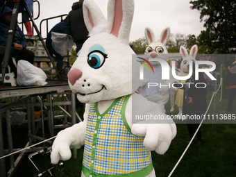 People in Easter Bunny costumes enter the 2024 White House Easter Egg Roll on the South Lawn of the White House in Washington, D.C. on April...