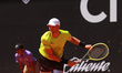 Benjamin Lock from Zimbabwe is hitting a backhand against Roberto Cid Subervi from the Dom...