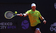 Benjamin Lock from Zimbabwe is hitting a backhand against Roberto Cid Subervi from the Dom...