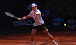 Tristan Schoolkate is hitting a forehand against Marc Polmans during the Mexico City Open...