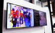 Screens are displaying features of artificial intelligence-equipped surveillance cameras t...
