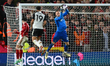Matz Sels, the Nottingham Forest goalkeeper, is saving the ball under pressure from Rodrig...