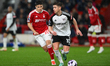Tom Cairney of Fulham is under pressure from Gio Reyna of Nottingham Forest during the Pre...