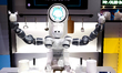 A robot with two arms is performing a MIL-STD-810G test on a Samsung Galaxy Z Flip 5 at th...