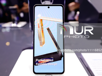 The Nubia Flip 5G, a horizontally folding smartphone developed by the Chinese manufacturer and former ZTE subsidiary, is being displayed in...