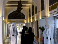 Customers are walking to a gold jewelry shop in the Doha Gold Souq ahead of Eid al-Fitr, which marks the end of the holy month of Ramadan, i...