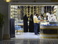 People are shopping for jewelry at the Doha Gold Souq ahead of Eid al-Fitr, which marks the end of the holy month of Ramadan, in Doha, Qatar...