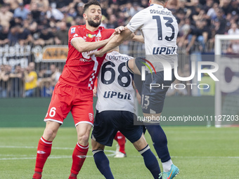 Roberto Gagliardini, Stanislav Lobotka, and Amir Rrahmani are in action during the Serie A football match between AC Monza and SSC Napoli at...