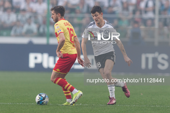 Adrian Dieguz and Mark Gual are playing during the Legia Warsaw vs Jagiellonia PKO Ekstraklasa match in Warsaw, Poland, on April 7, 2024. 