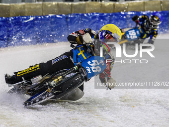 Stefan Svensson (58) in yellow is leading Martin Haarahiltunen (199) during the FIM Ice Speedway Gladiators World Championship Final 4 at Ic...