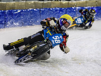 Stefan Svensson (58) in yellow is leading Martin Haarahiltunen (199) during the FIM Ice Speedway Gladiators World Championship Final 4 at Ic...