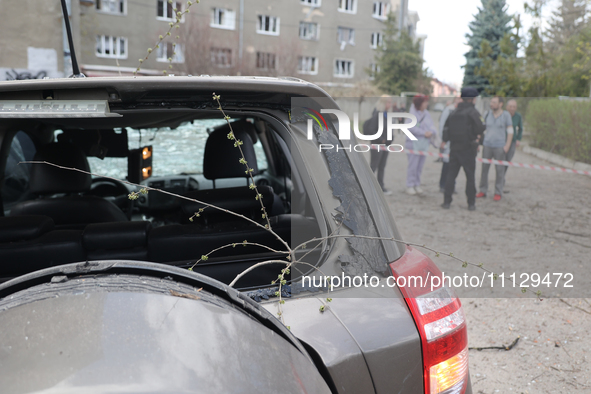 A car with a broken rear window is pictured after a Russian precision-guided munition struck civil infrastructure in Kharkiv, northeastern U...