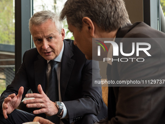 French Minister of the Economy Bruno Le Maire is speaking with German Vice Chancellor and Minister of the Economy Robert Habeck (right) at H...