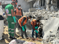 Rescuers and medics are searching for bodies inside the damaged Al Shifa Hospital after Israeli forces withdrew from the hospital and the su...