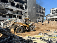 Rescuers and medics are searching for bodies inside the damaged Al Shifa Hospital after Israeli forces withdrew from the hospital and the su...