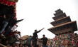 Nepalese people are pulling the chariot of Deity Bhairab during the celebrations of the tr...