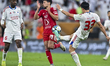 Youssef Msakni (C) of Al Arabi SC is battling for the ball with Yumin Cho of Sharjah FC du...